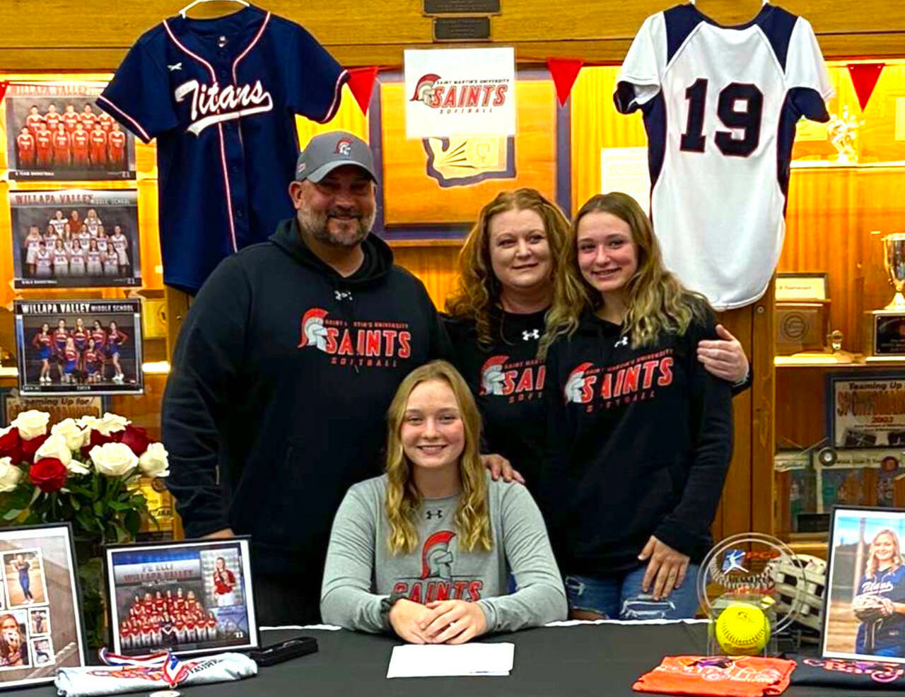 Pe Ell-Willapa Valley standout pitcher Olivia Matlock, seated, signed a National Letter of Intent on Thursday to play softball for Saint Martin’s University. Pictured with Matlock are family members (from left), Pat Matlock (father), Torrie Matlock (mother) and Lauren Matlock (sister).